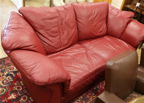 A red leather settee W.220cm